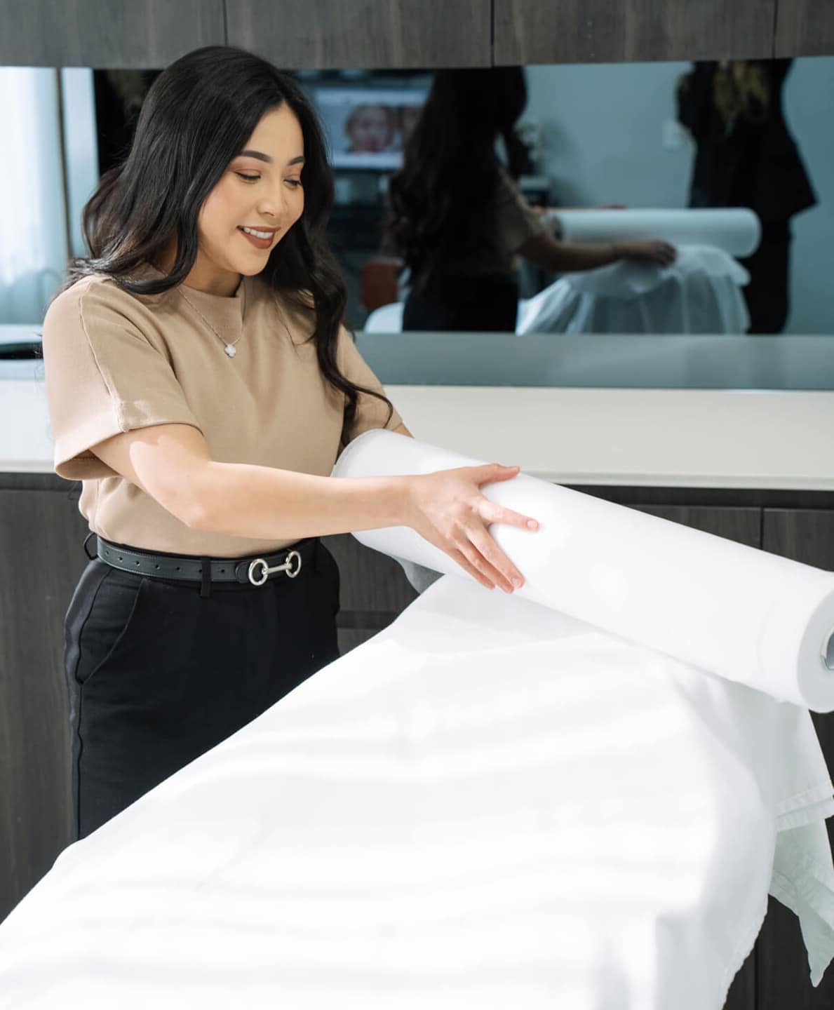Cosmetic Nurse Susan, preparing treatment bed at Narellan cosmetic clinic