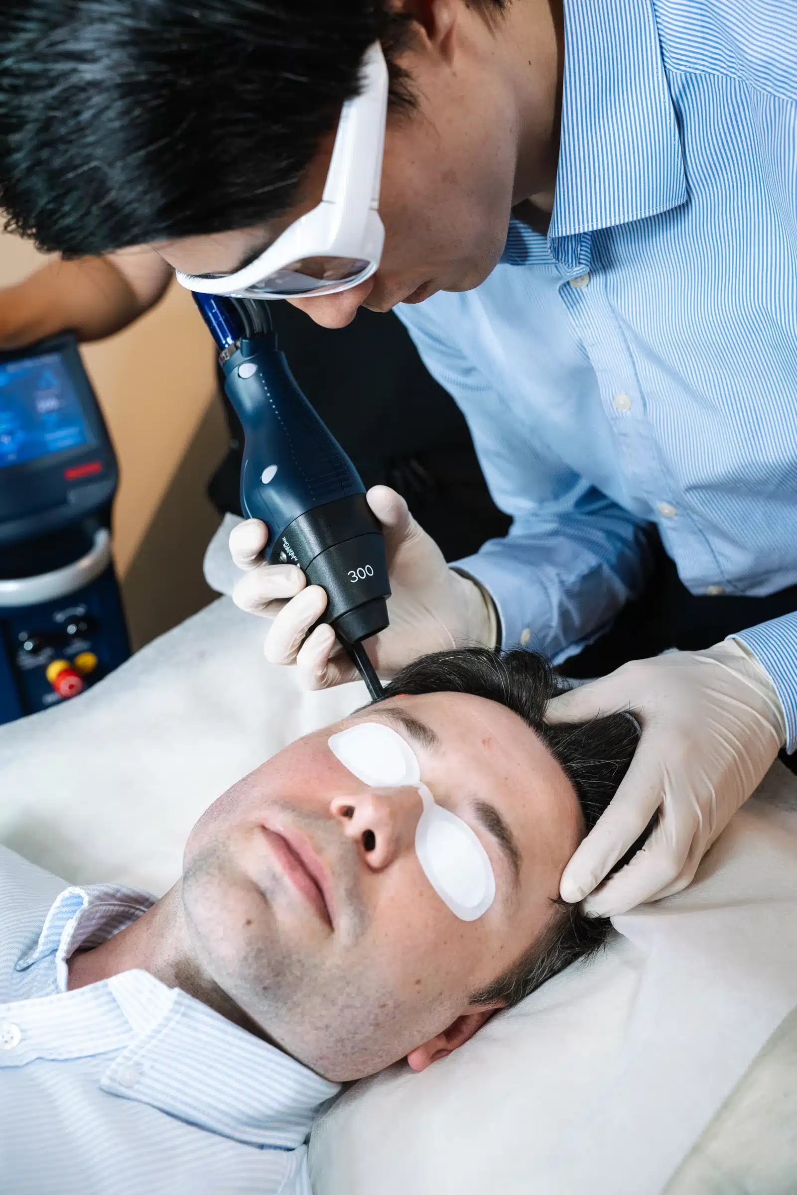 Male having skin treatment with cosmetic doctors to slow skin ageing with skincare
